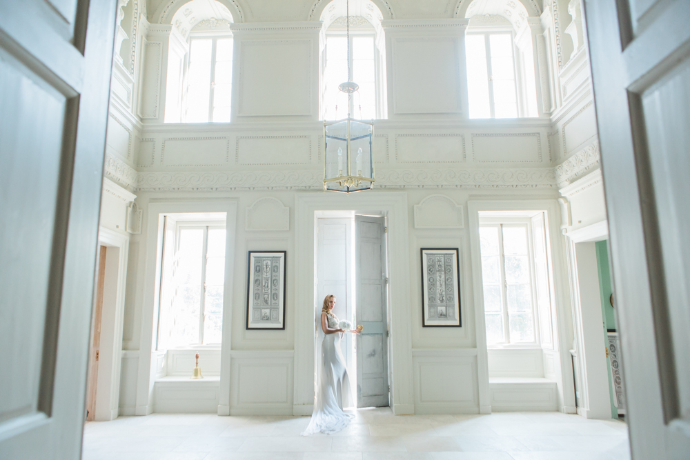 bride walking out the front door at Gloster House