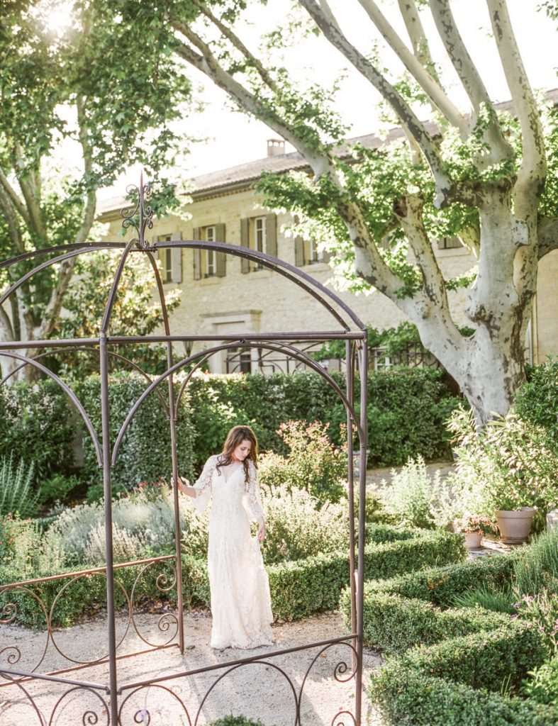 Warm and soft portrait of a bride during an intimate Provence elopement, surrounded by sunlit lavender fields