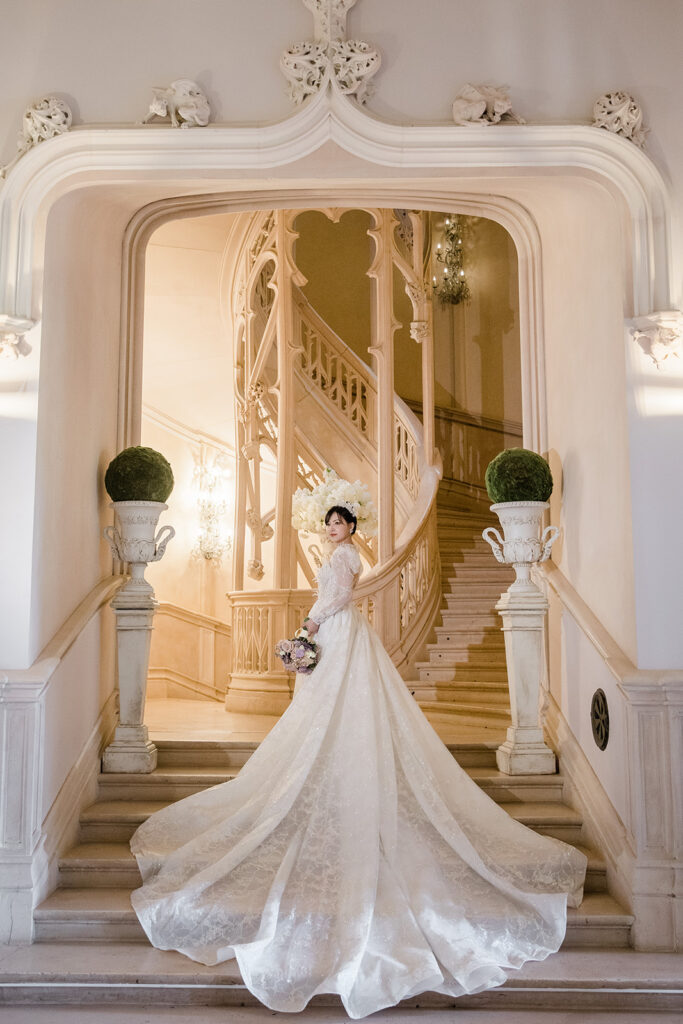 Majestic bridal portrait on the stairs of Château Challain