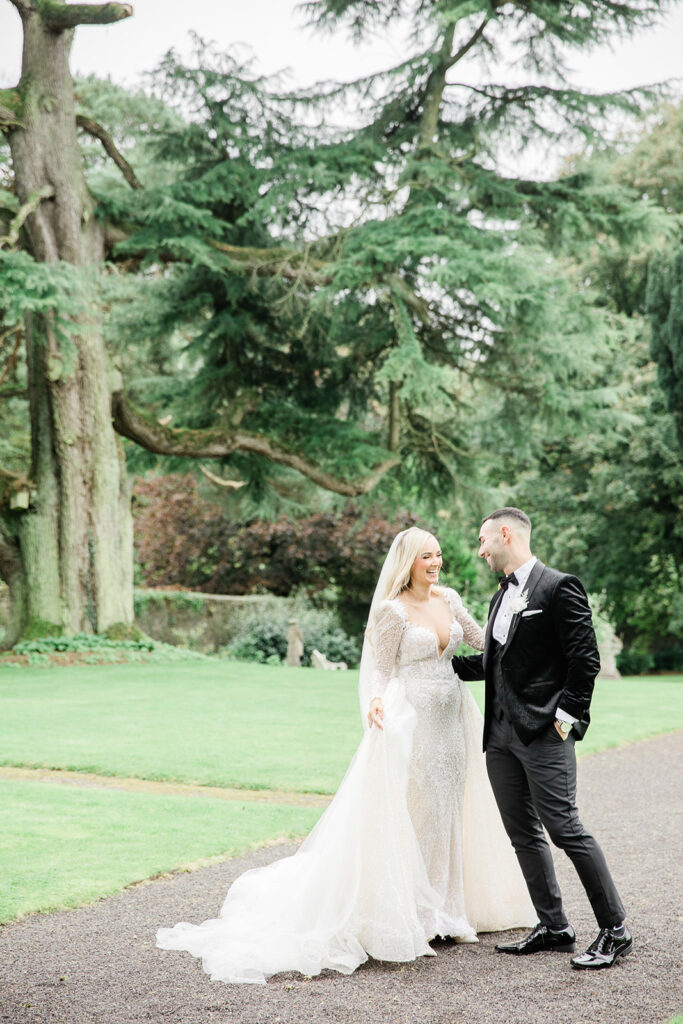 a couple walking in the gardens of Tankardstown House